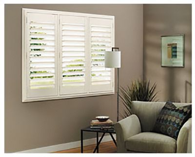 Love is Blinds St. Louis: A living room with a couch and a window with white shutters