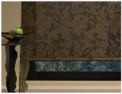 Love is Blinds St. Louis: A bowl of apples sits on a table in front of a wall with a floral window shade.