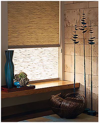 Love is Blinds St. Louis: A living room with window roller shades  and a basket on the floor