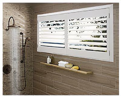Love is Blinds St. Louis: A bathroom with a shower and a window with shutters on it.
