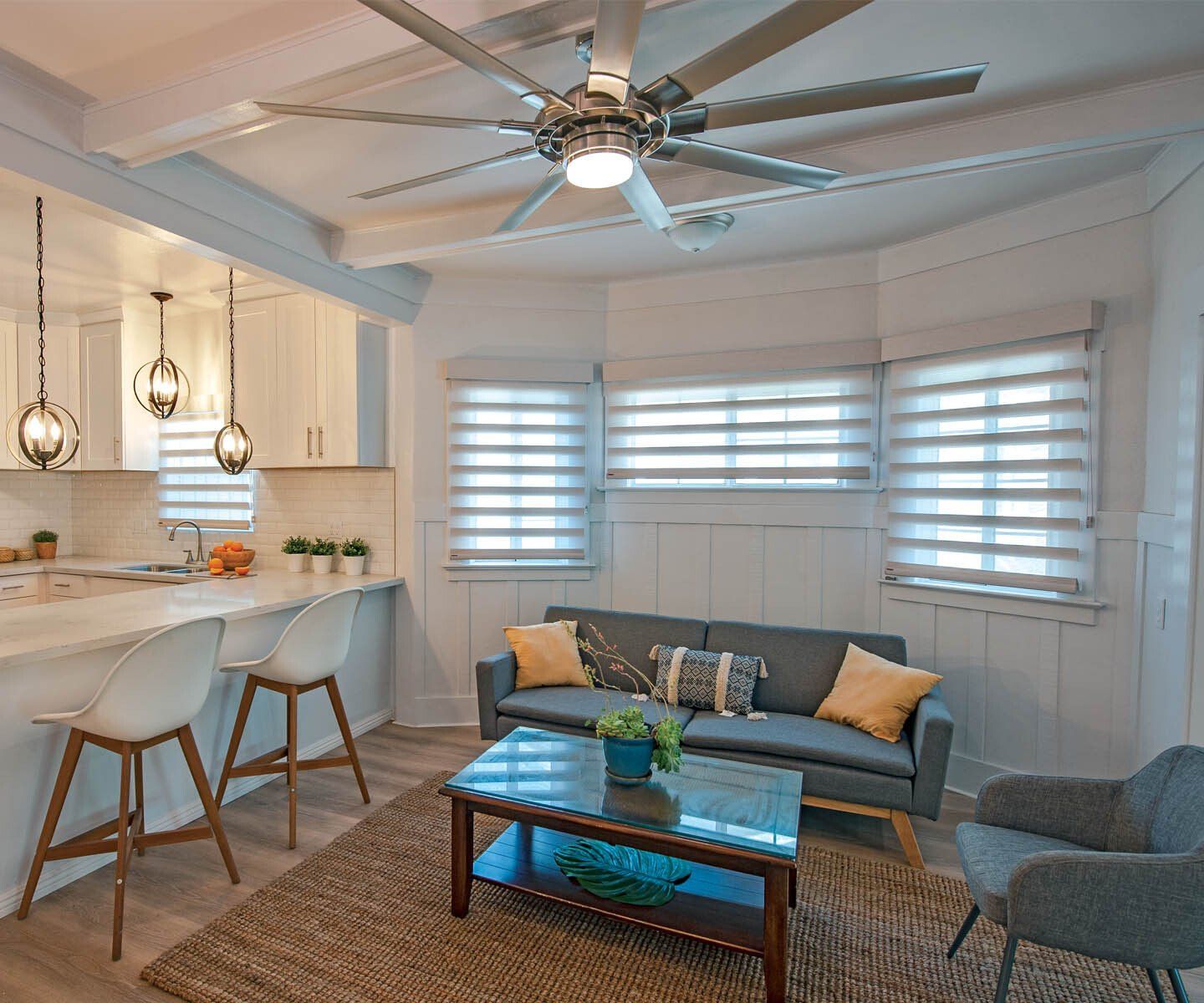 a living room with a ceiling fan, a couch, and sheer shades Love is Blinds Missouri (314) 808-3440