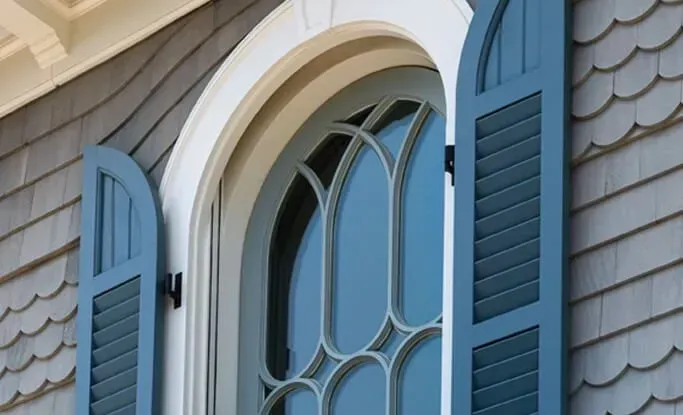 Why Arched Windows Need Specialized Exterior Shutters
