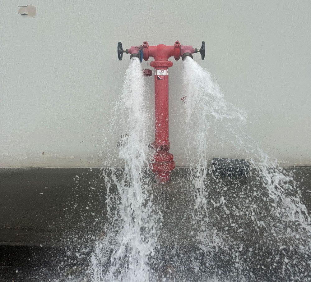 Water Gushing From A Fire Hydrant System