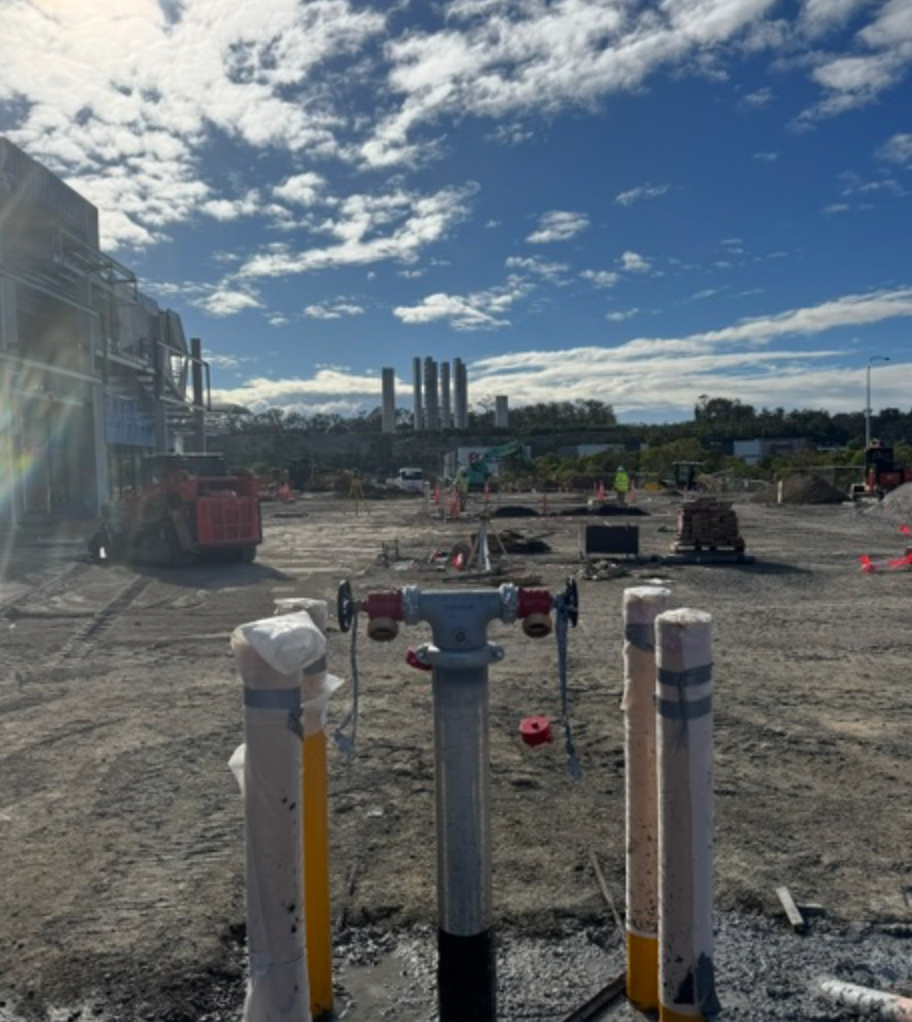 Fire Hydrant Standpipe With Bollards On Open Construction Site &mdash; Commercial Leak Detection in Mudgeeraba, QLD