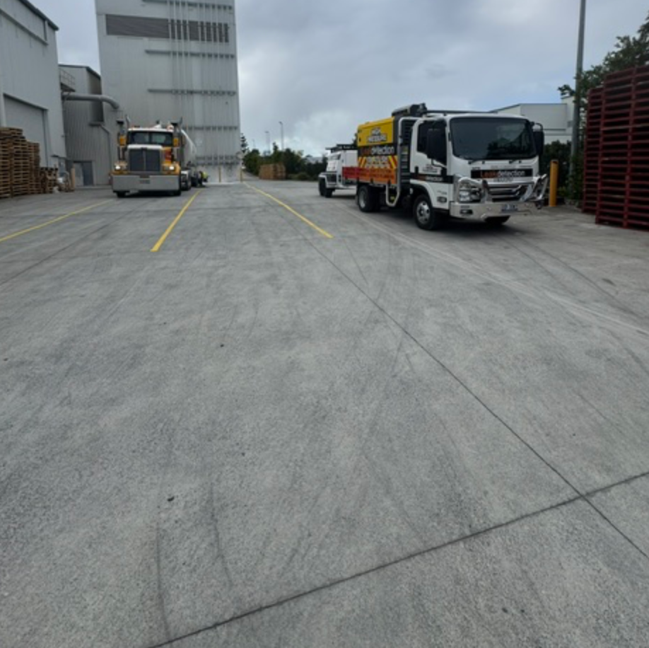 Leak Detection Truck Parked Near Pallet Stack And Semi Truck — Commercial Leak Detection in Mudgeeraba, QLD