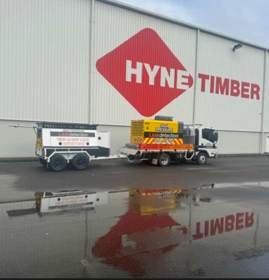Leak Detection Truck And Trailer Reflected In Wet Pavement &mdash; Commercial Leak Detection in Mudgeeraba, QLD