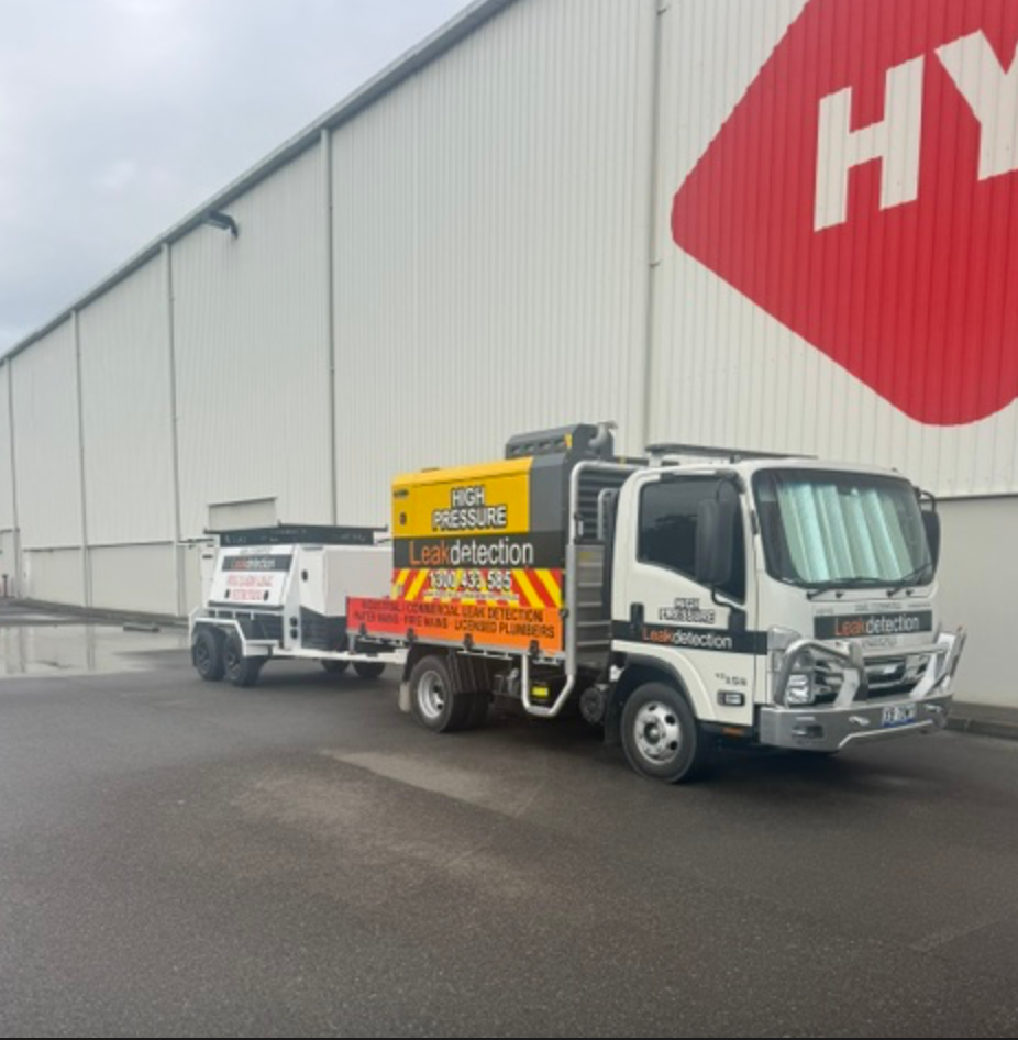 Leak Detection Truck And Trailer Beside Hyne Timber Building — Commercial Leak Detection in Mudgeeraba, QLD