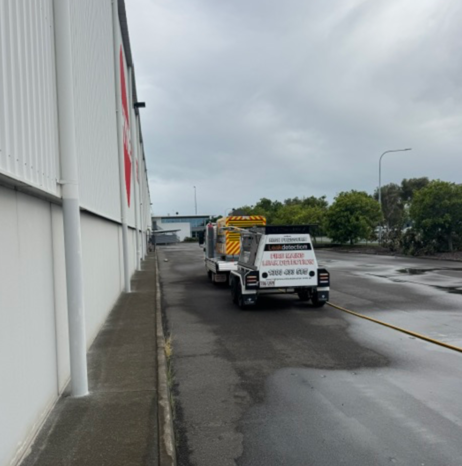 Fire Main Leak Detection Trailer Parked Beside Warehouse Wall — Commercial Leak Detection in Mudgeeraba, QLD