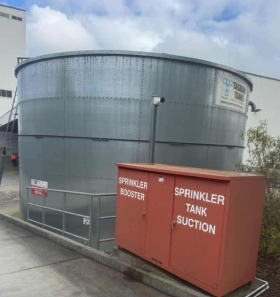 Sprinkler Booster And Tank Suction Cabinet Beside Steel Water Tank — Commercial Leak Detection in Mudgeeraba, QLD