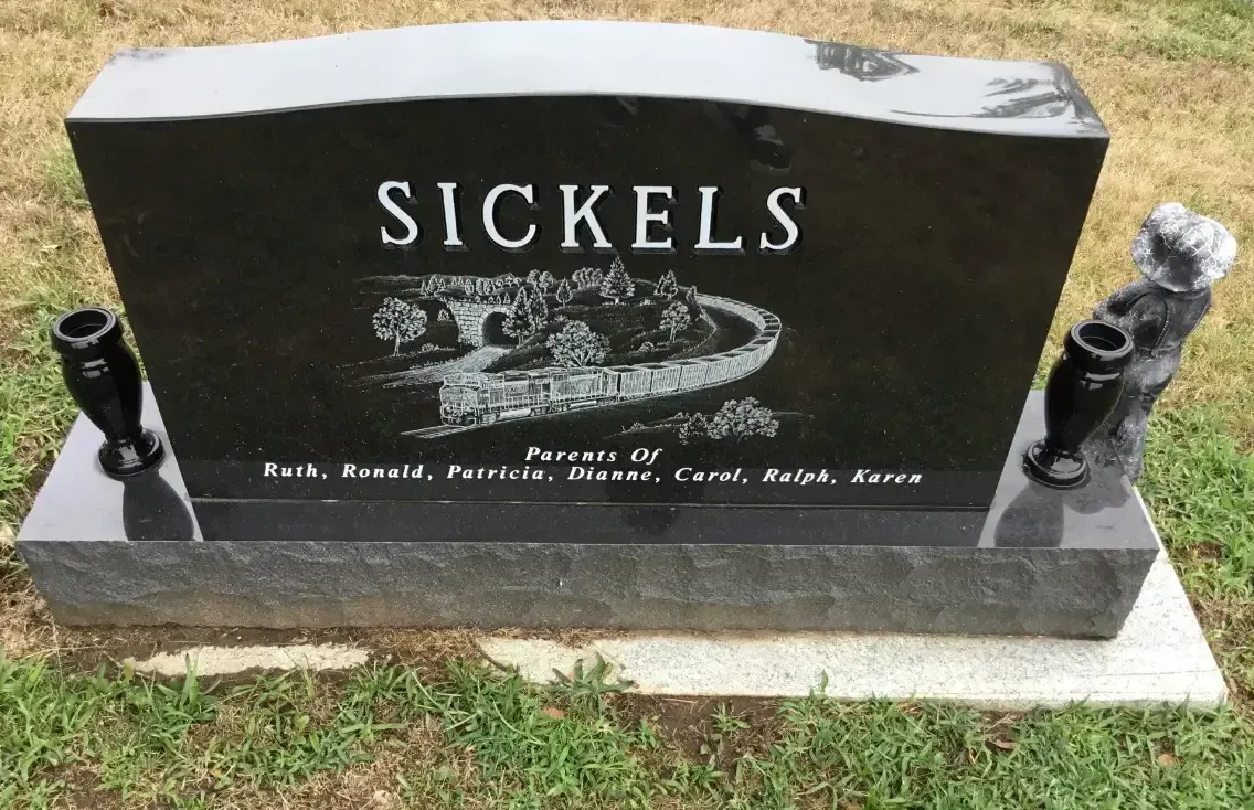 Black granite SICKELS headstone with engraved photo, on grass with vase holders on both sides