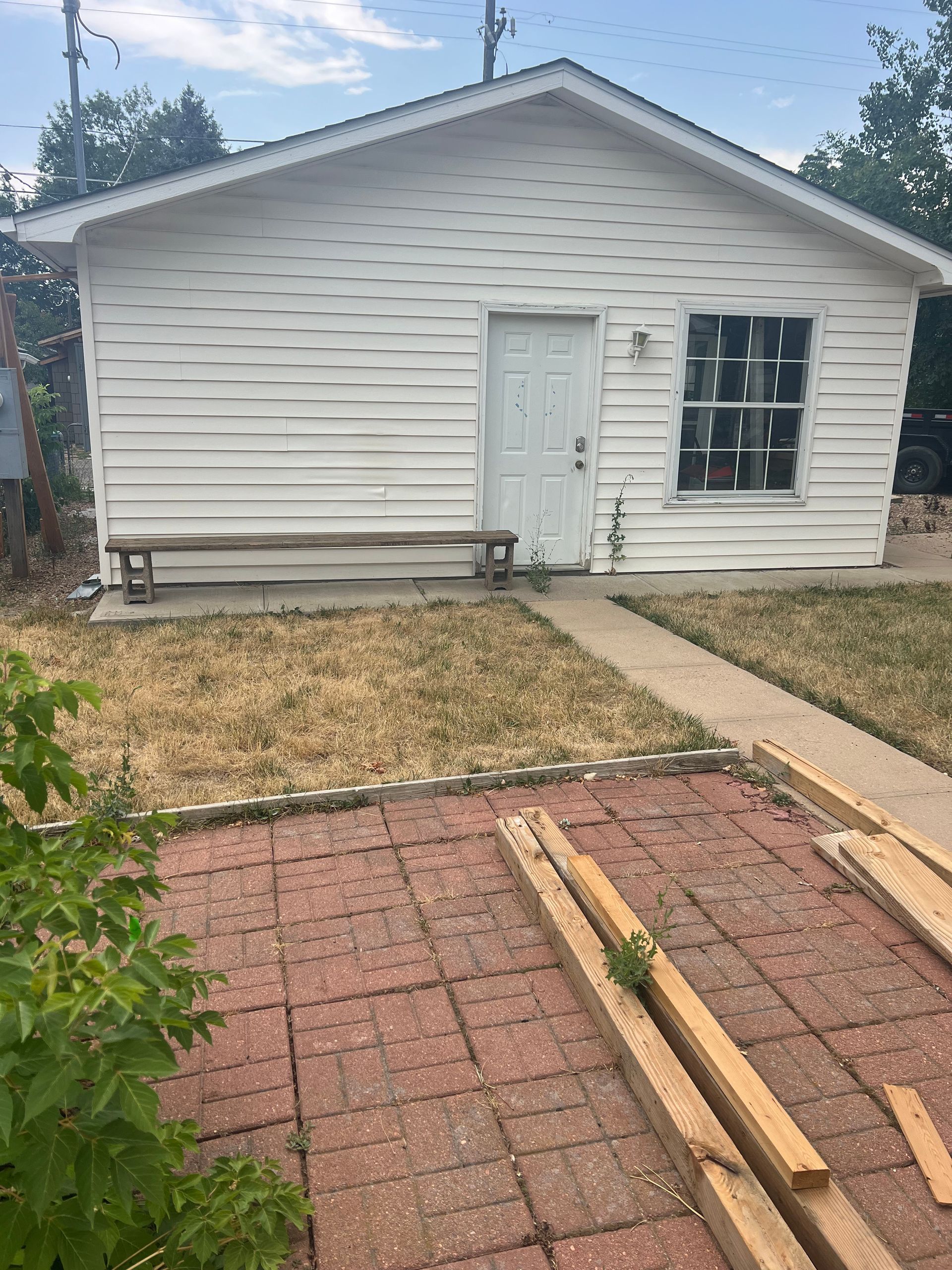 Rear exterior of the original house at 1234 Jefferson Avenue before redevelopment