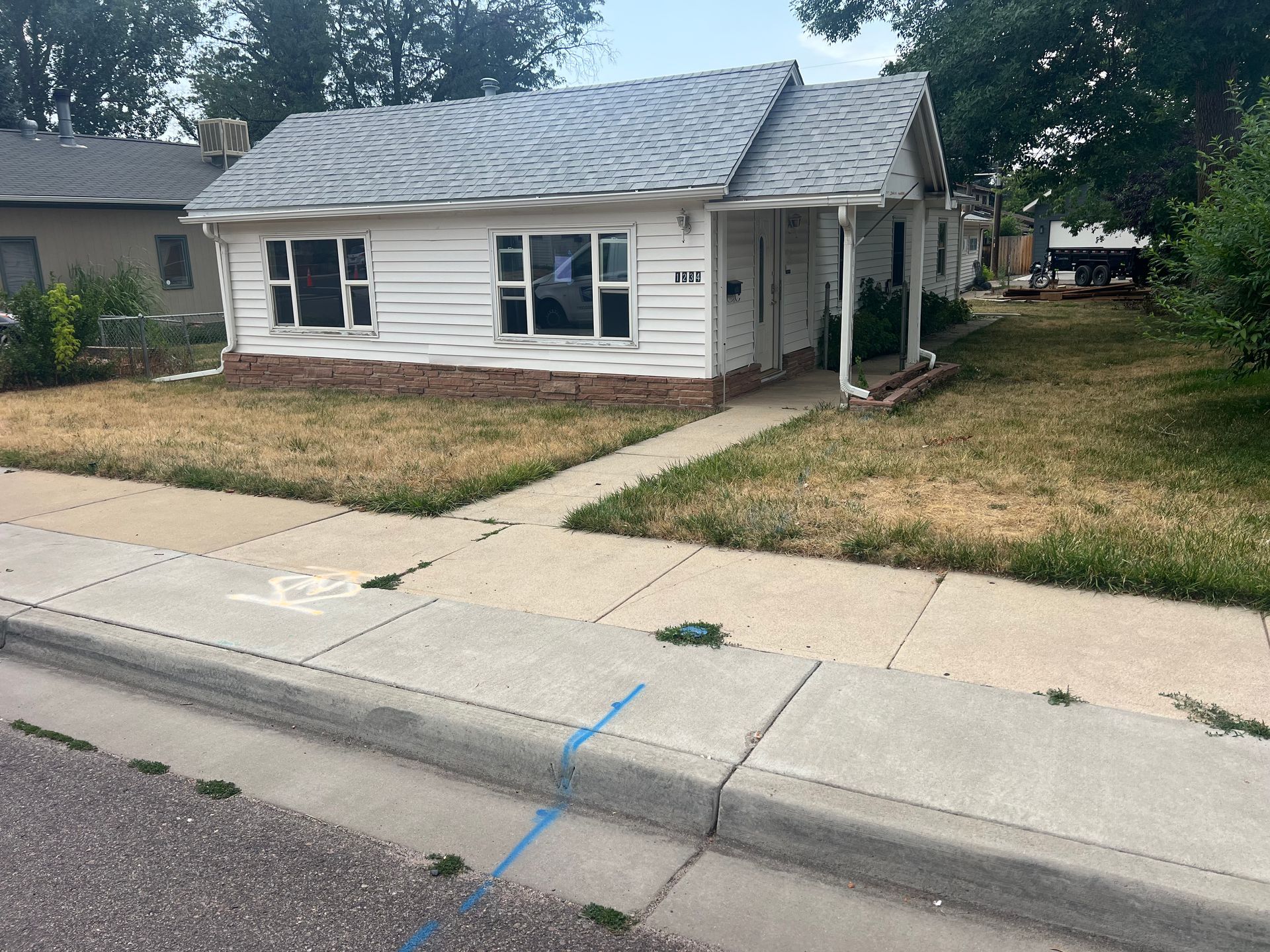 Front exterior of the original house at 1234 Jefferson Avenue before redevelopment