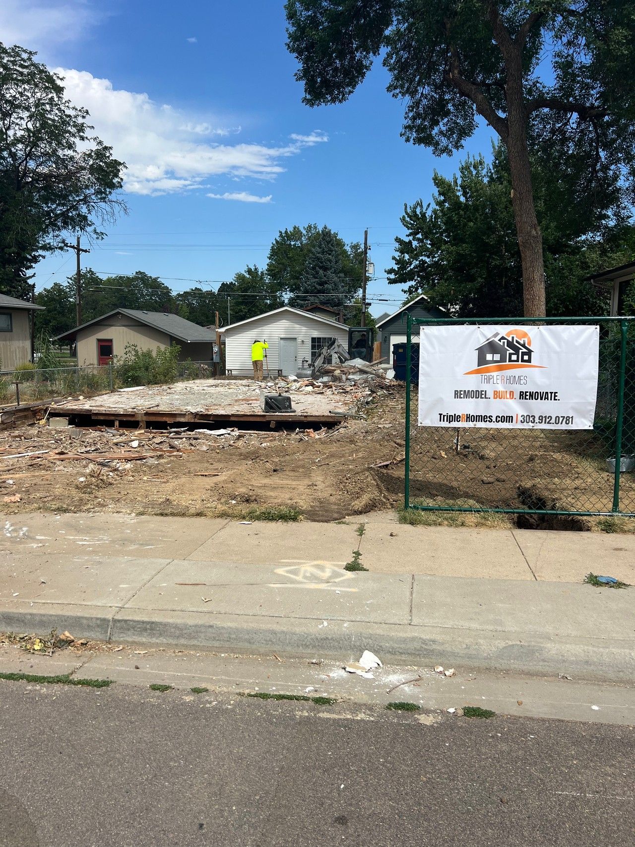 1234 Jefferson Avenue site during demolition with construction fencing and sign