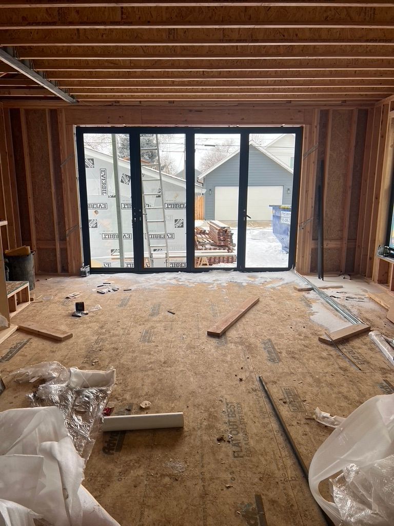 Unfinished framed interior with sliding glass doors at 1234 Jefferson Avenue
