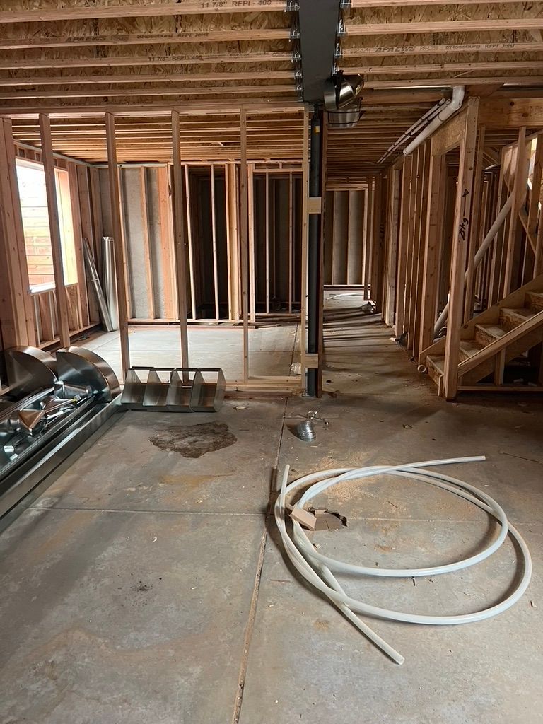 Interior framing and plumbing rough-in at 1234 Jefferson Avenue