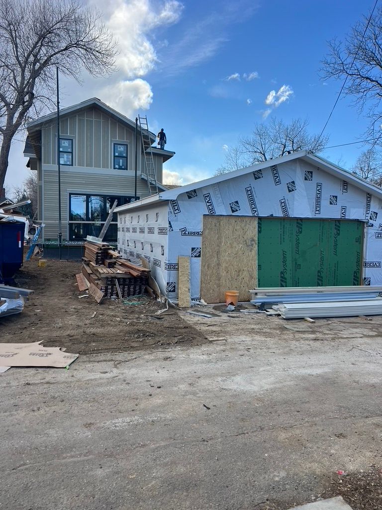 House and detached garage at 1234 Jefferson Avenue during construction
