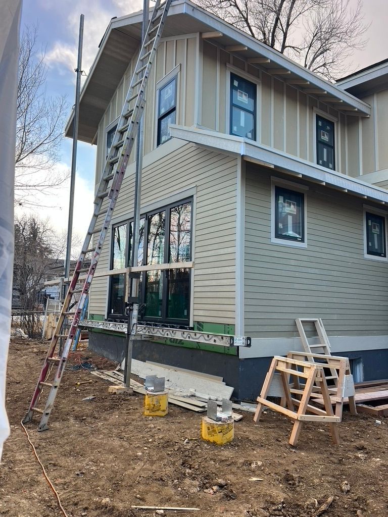 Exterior windows and siding at 1234 Jefferson Avenue during construction