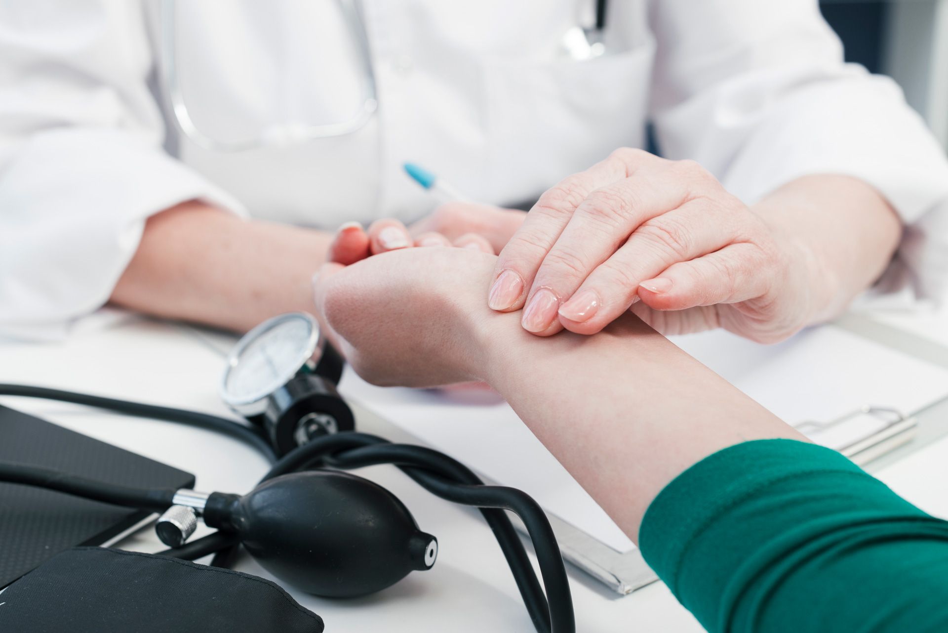 doctors hand tending patient