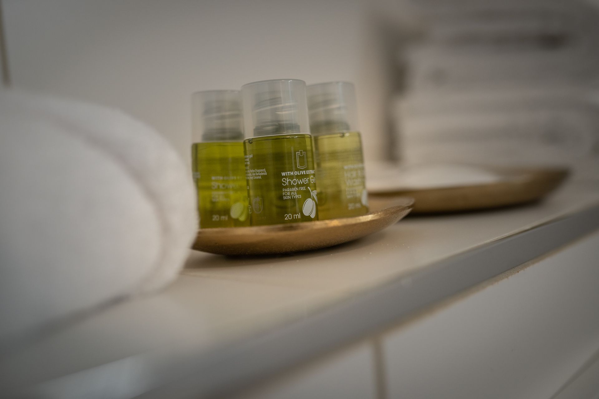 A tray of bottles of shampoo and conditioner on a counter.