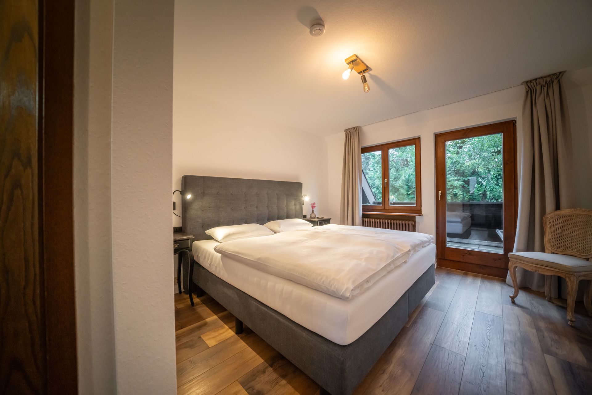 There is a large bed in the middle of the room.