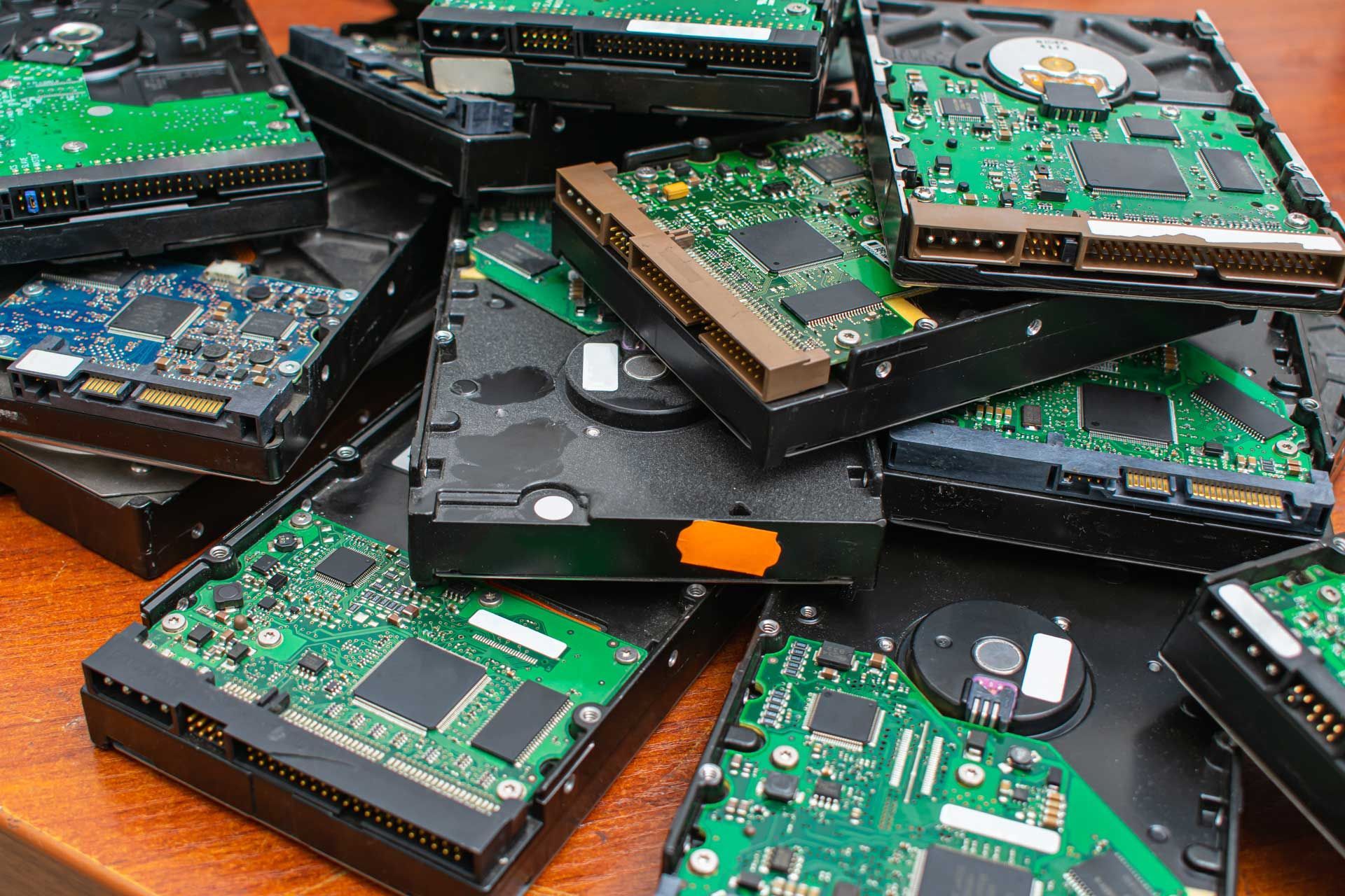A bunch of hard drives are stacked on top of each other