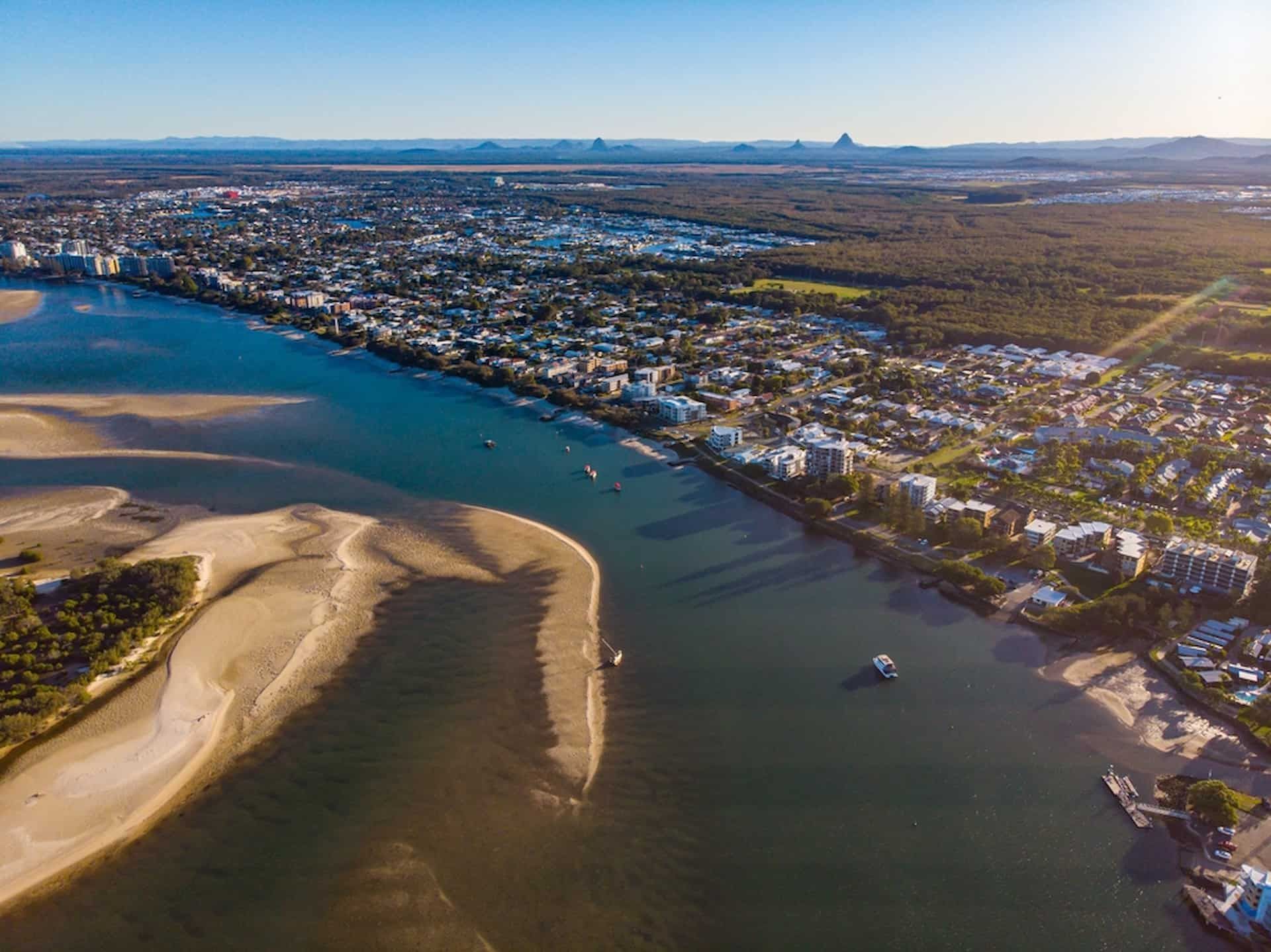 An Aerial View Of A River With A City In The Background — Tom Thumbs Tree Works In Bribie Island, QLD