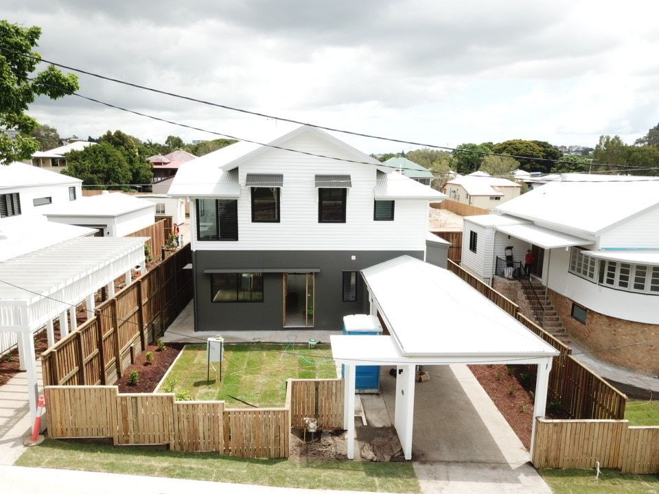 An Aerial View Of A House With A Carport In Front Of It โ Harrison Development Group In Surfers Paradise, QLD