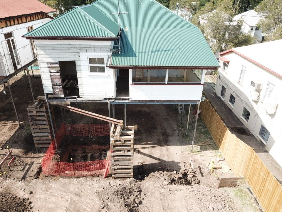 An Aerial View Of A House Under Construction With A Green Roof โ Harrison Development Group In Surfers Paradise, QLD