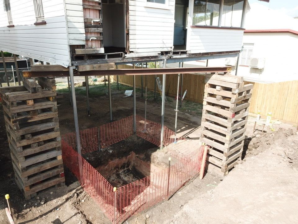 There Is A Hole In The Ground In Front Of A House That Is Being Built โ Harrison Development Group In Surfers Paradise, QLD