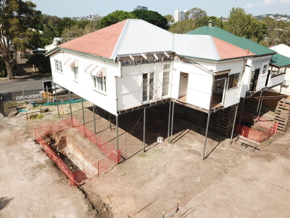 An Aerial View Of A House Being Built On Stilts โ Harrison Development Group In Surfers Paradise, QLD