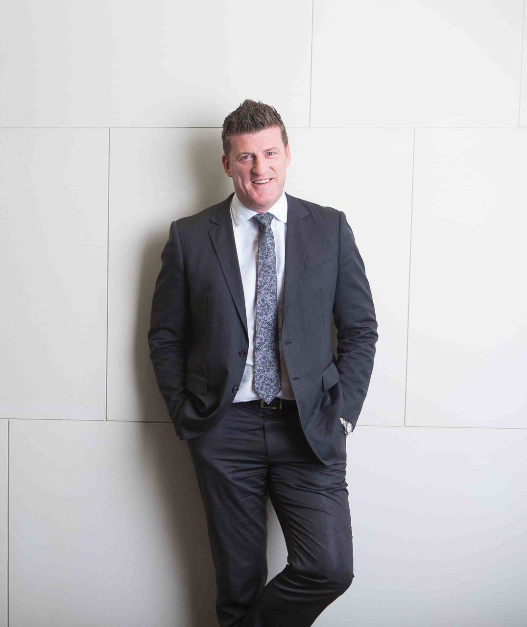 A Man In A Suit And Tie โ Harrison Development Group In Surfers Paradise, QLD
