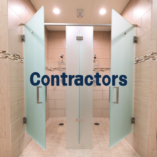 Frosted glass shower doors in a tiled bathroom; text