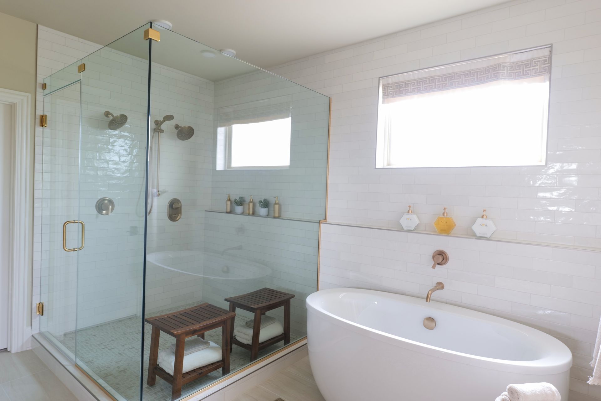 Custom frameless glass shower enclosure by Wingspan at the 2026 MBA Parade of Homes