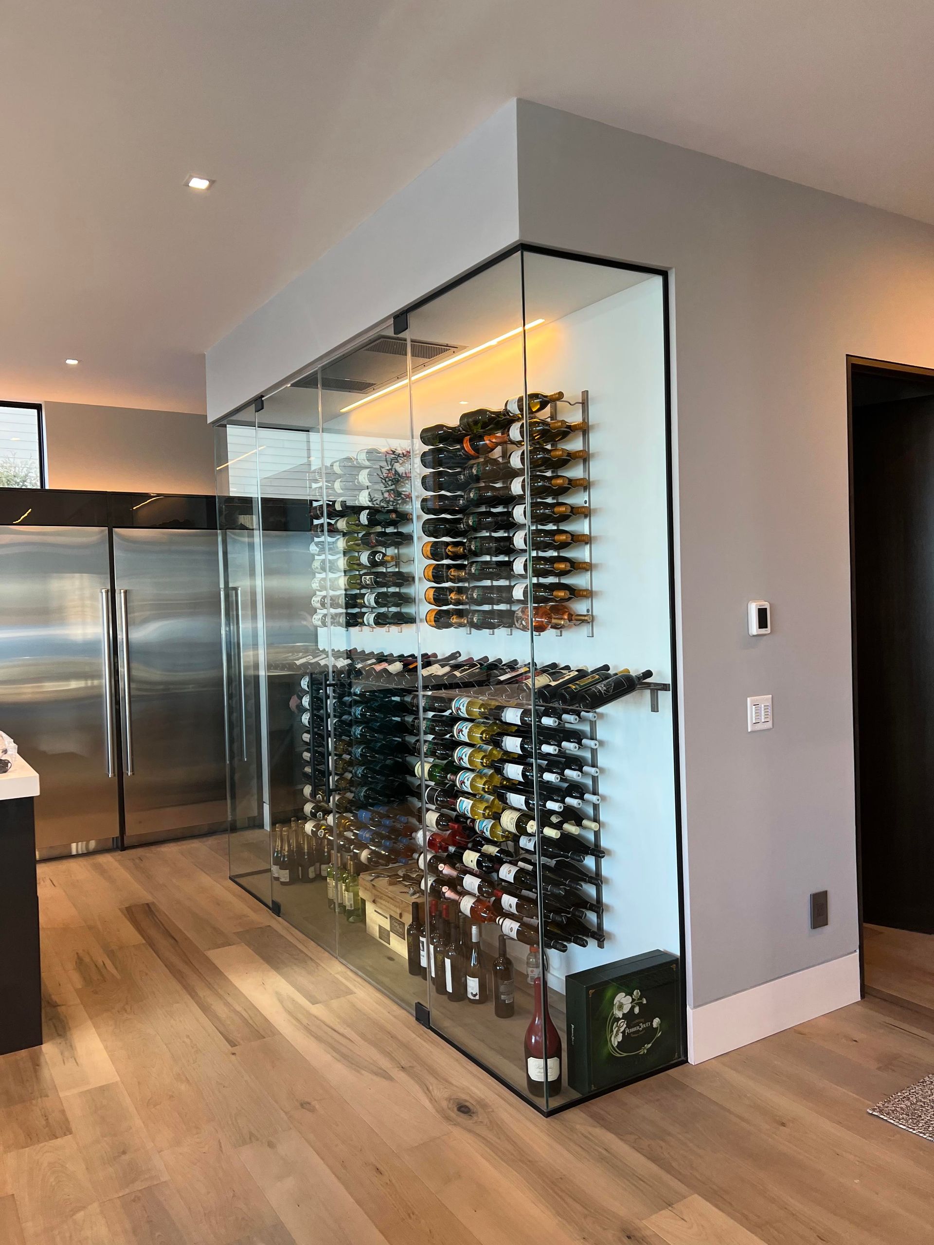 A wine cellar with a lot of wine bottles in it.