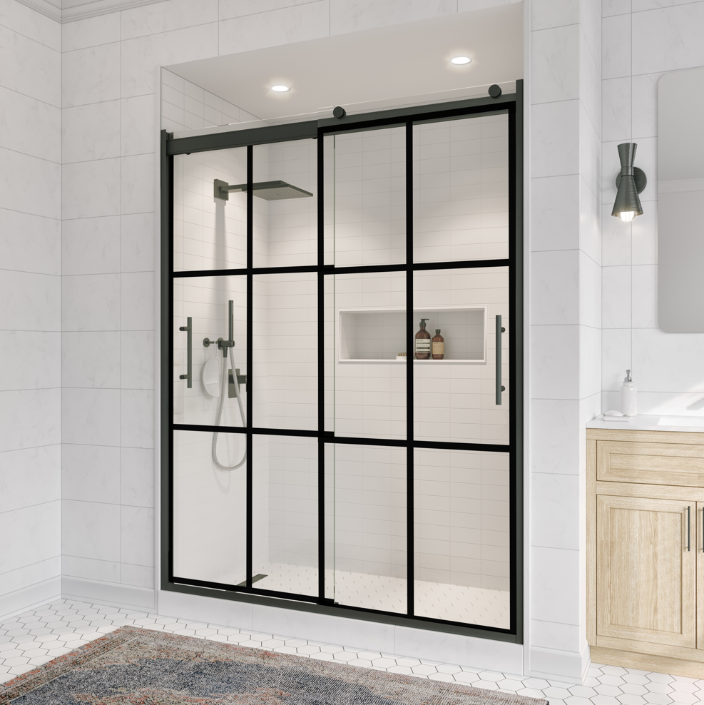 Black framed sliding shower door in a modern bathroom.
