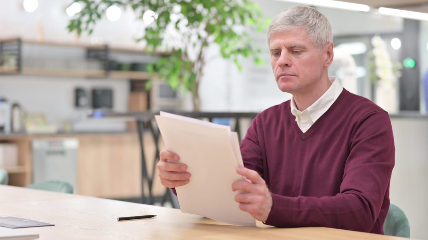 Man looking at how much cremation costs in California