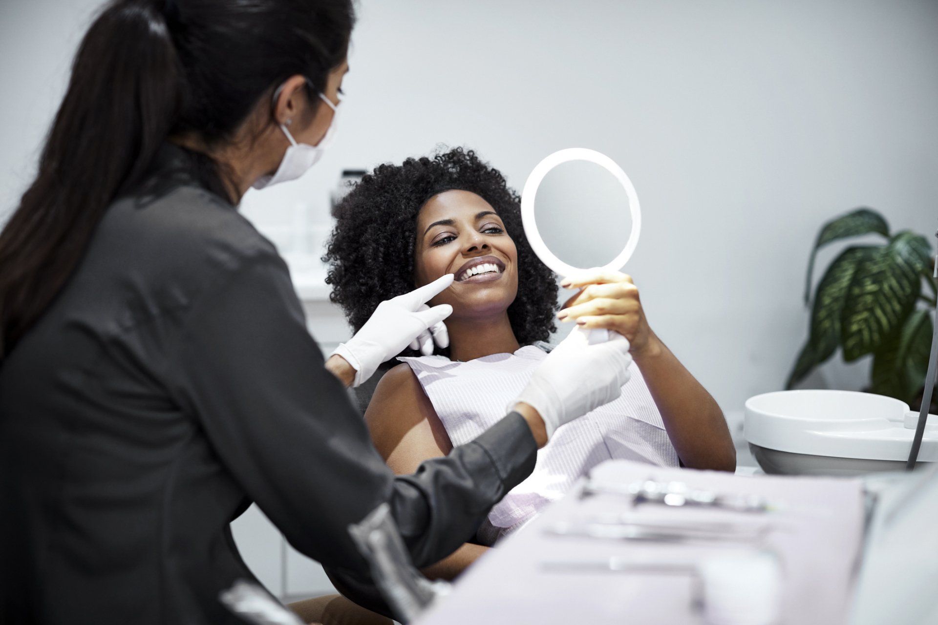 Patient Checking Her Teeth — Hampton, VA — Artisan Smiles Dental