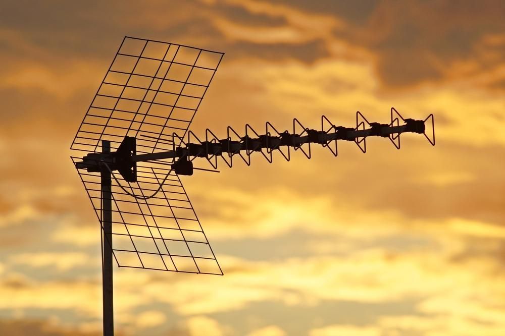 An Antenna Is Silhouetted Against A Cloudy Sky At Sunset — Highfields Antennas In Cabarlah, QLD
