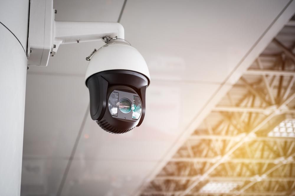 A Security Camera Is Hanging From The Ceiling Of A Building — Highfields Antennas In Blackbutt, QLD