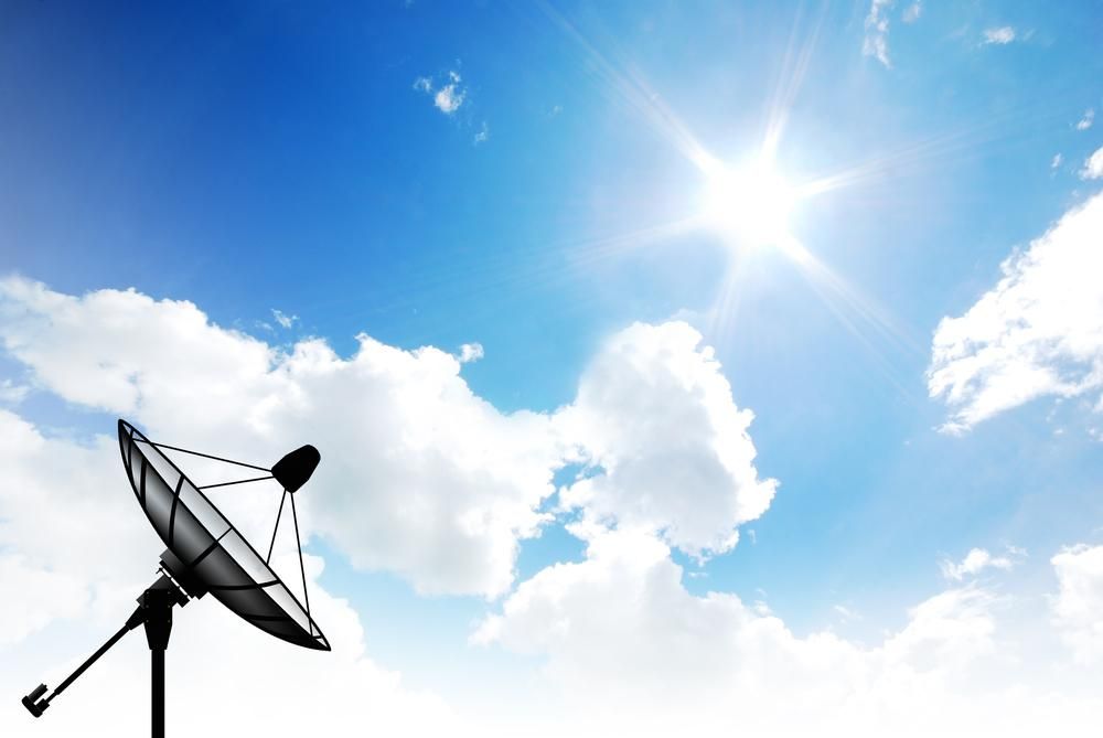 A Satellite Dish Against A Blue Sky With Clouds — Highfields Antennas In Cabarlah, QLD