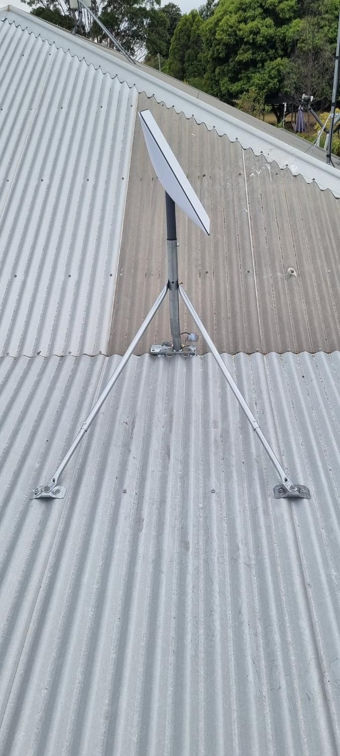 A Satellite Dish Is Sitting On Top Of A Metal Roof — Highfields Antennas In Cabarlah, QLD