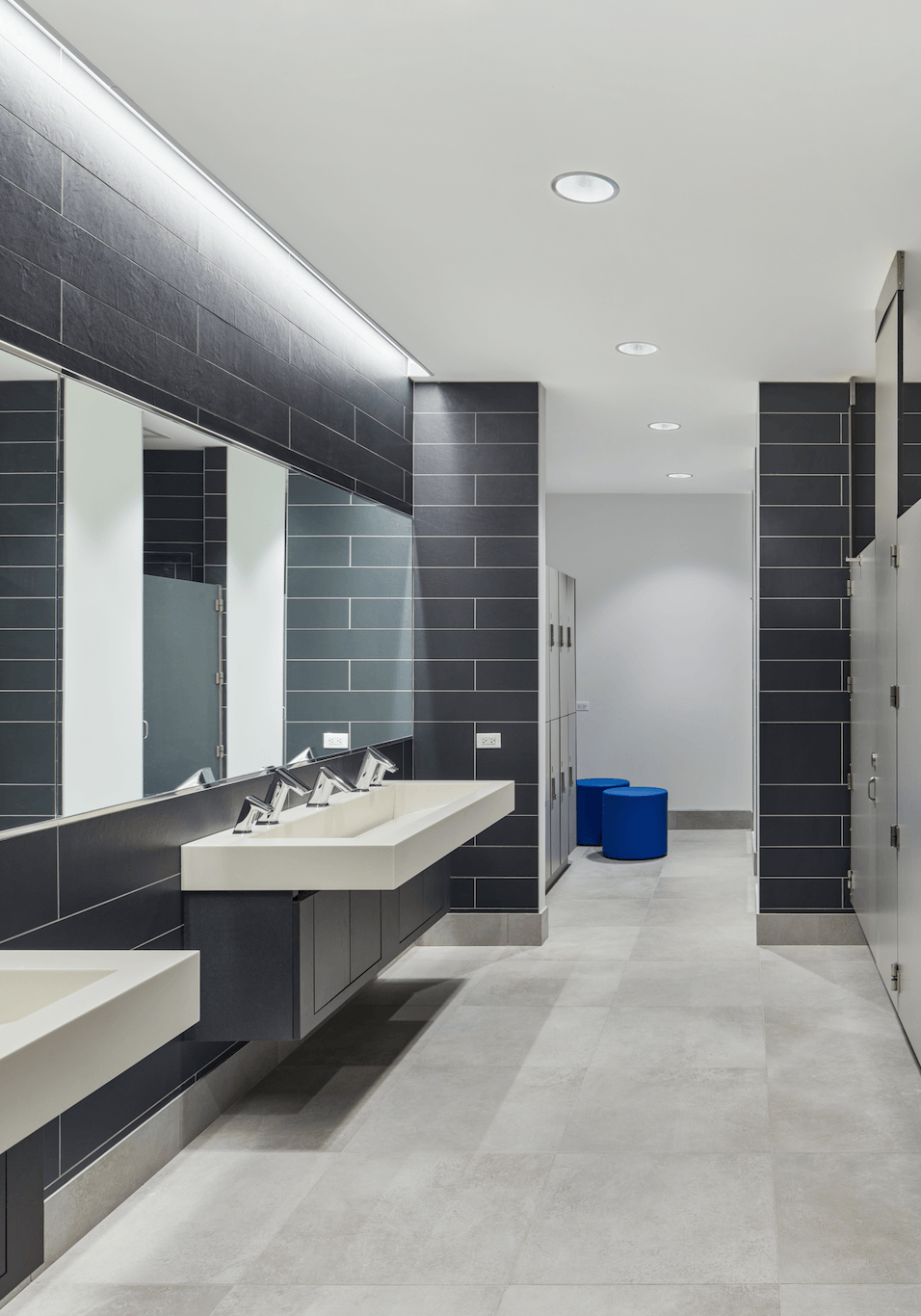 A bathroom with two sinks and two mirrors