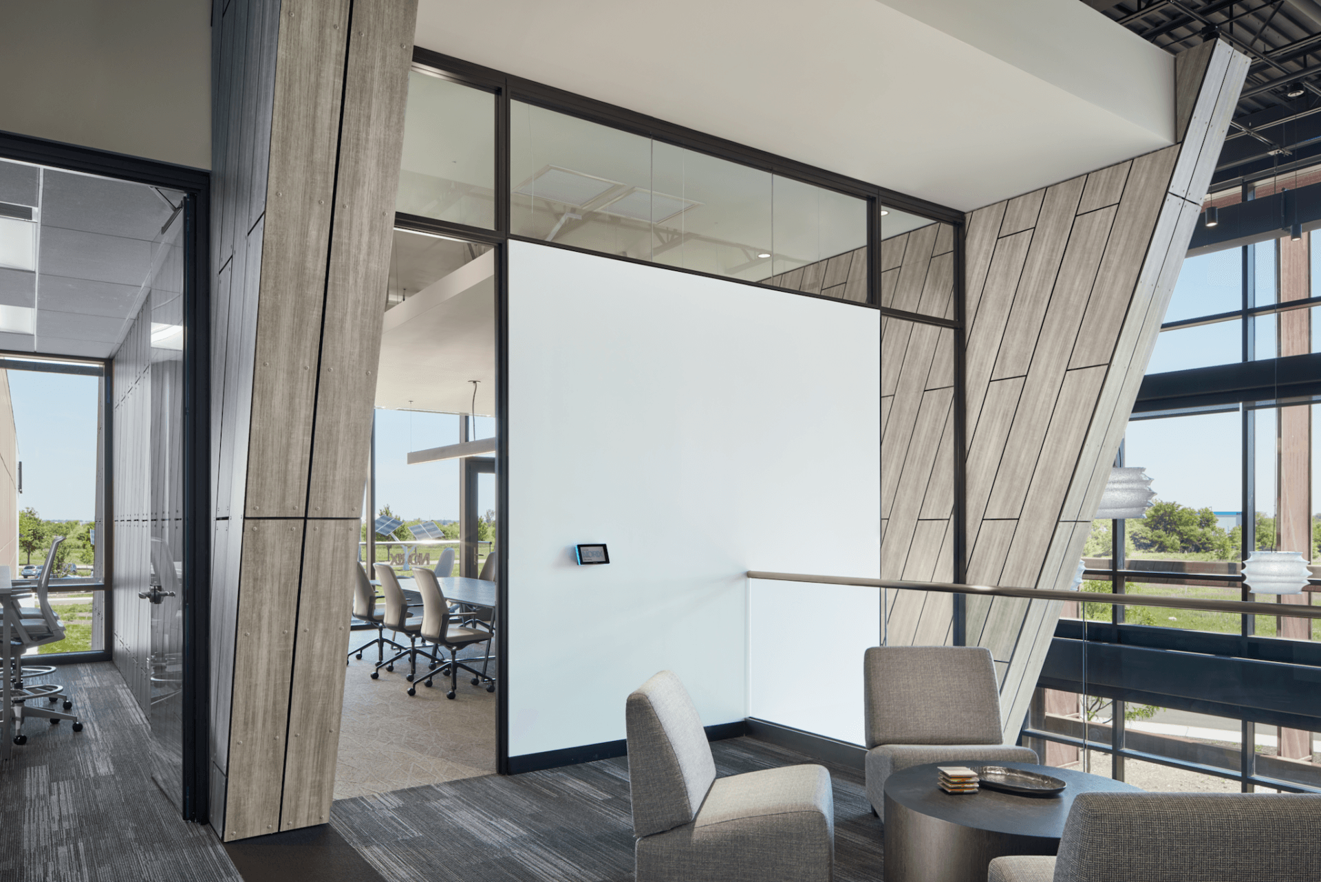 A room with a lot of windows and chairs in it