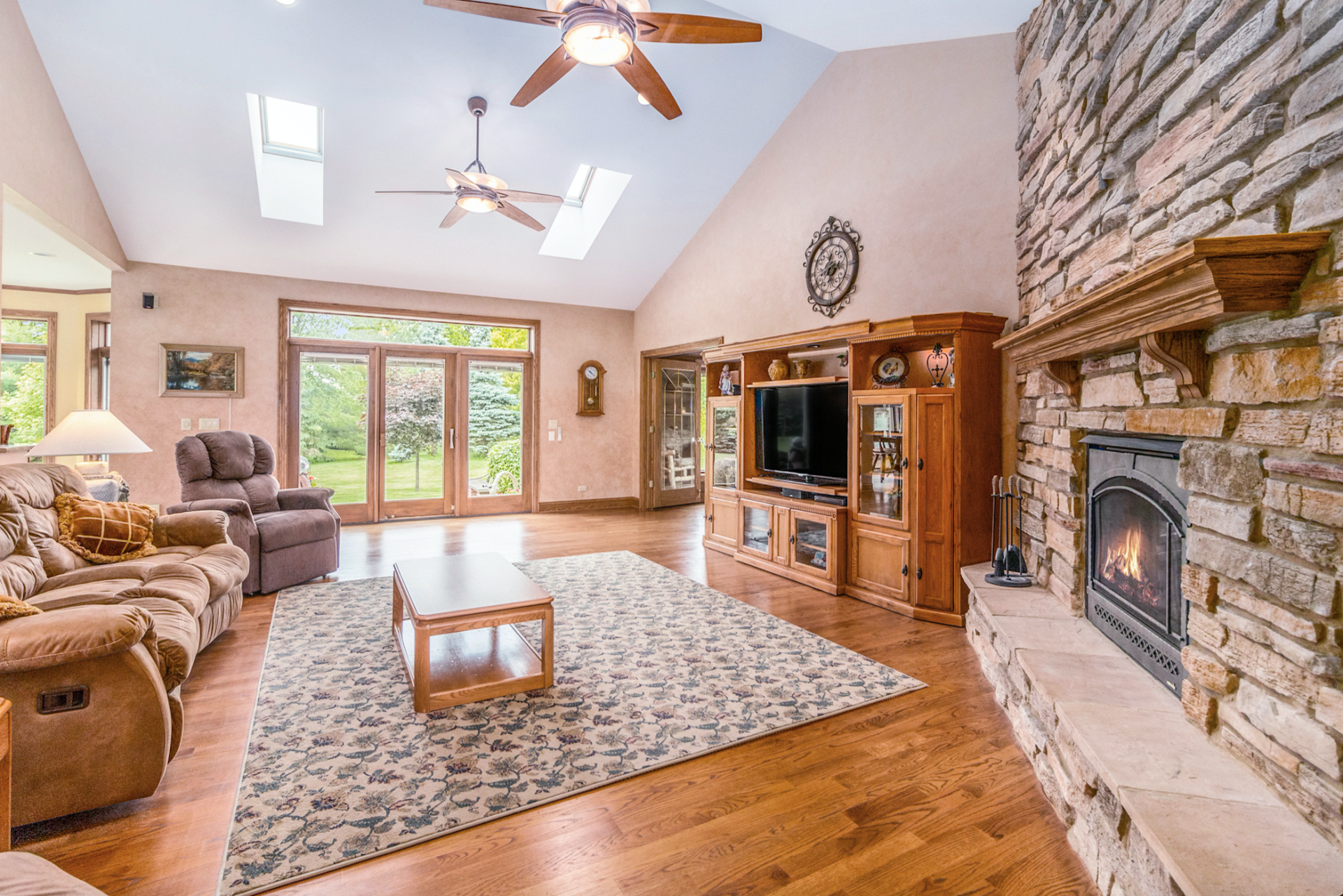 A living room filled with furniture and a fireplace.