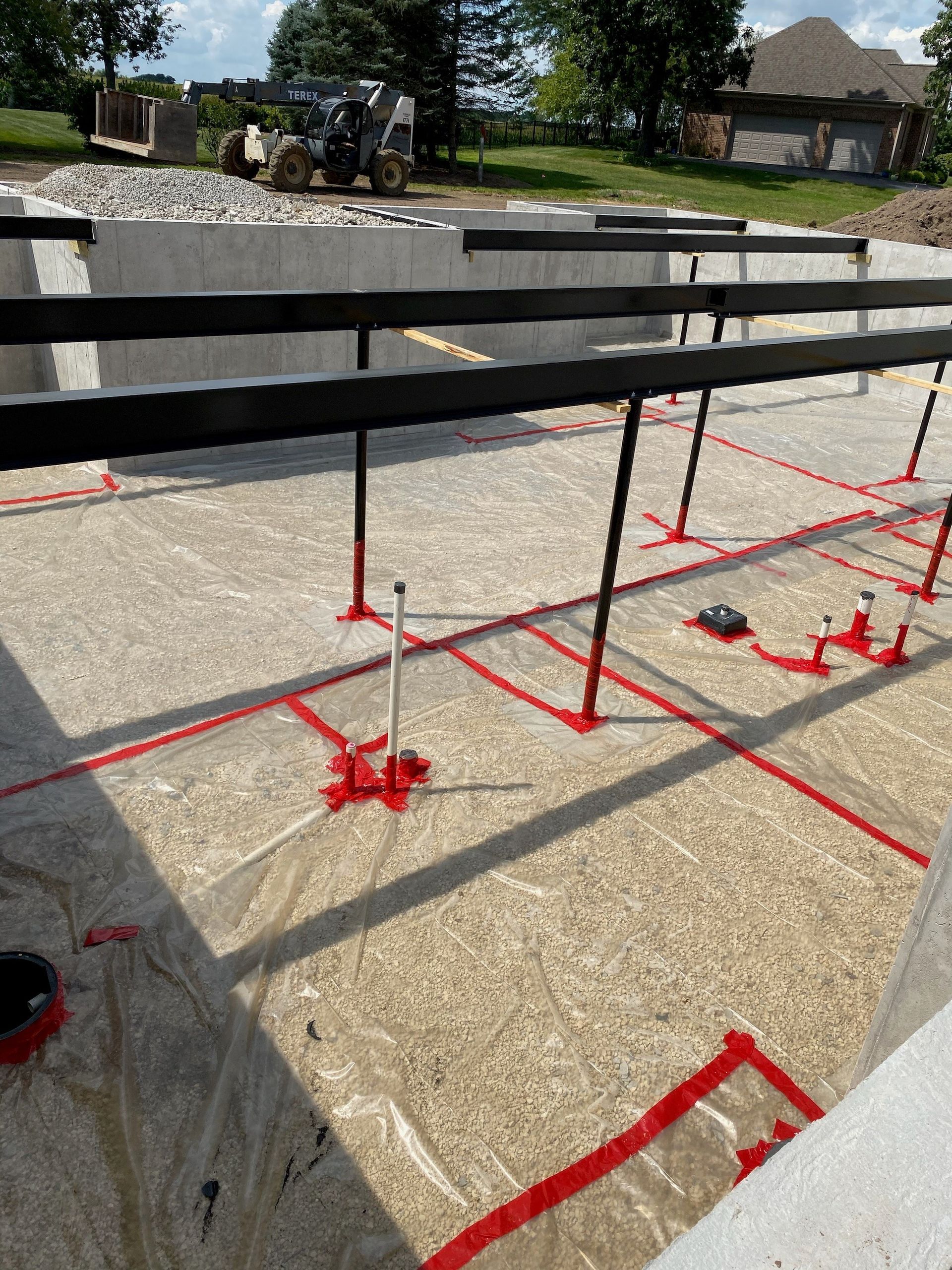 A construction site with red markings on the ground