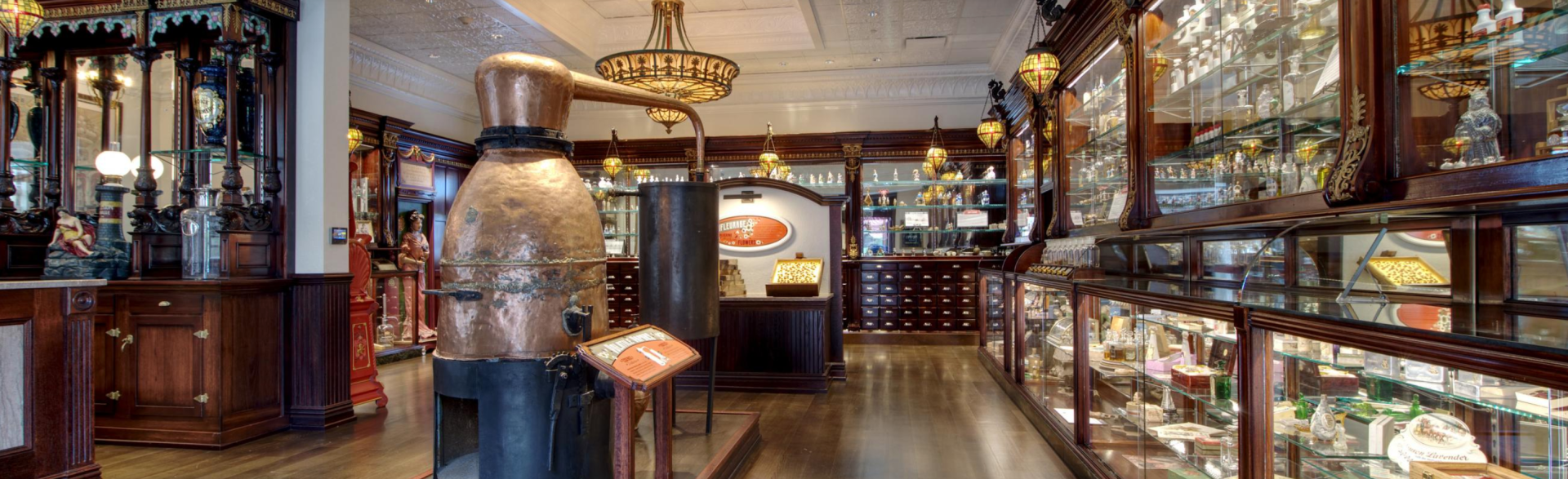 A long hallway filled with lots of display cases and a machine.