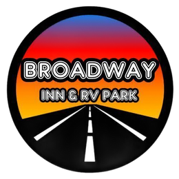 Broadway Inn & RV Park logo: circular, road at sunset, with text 