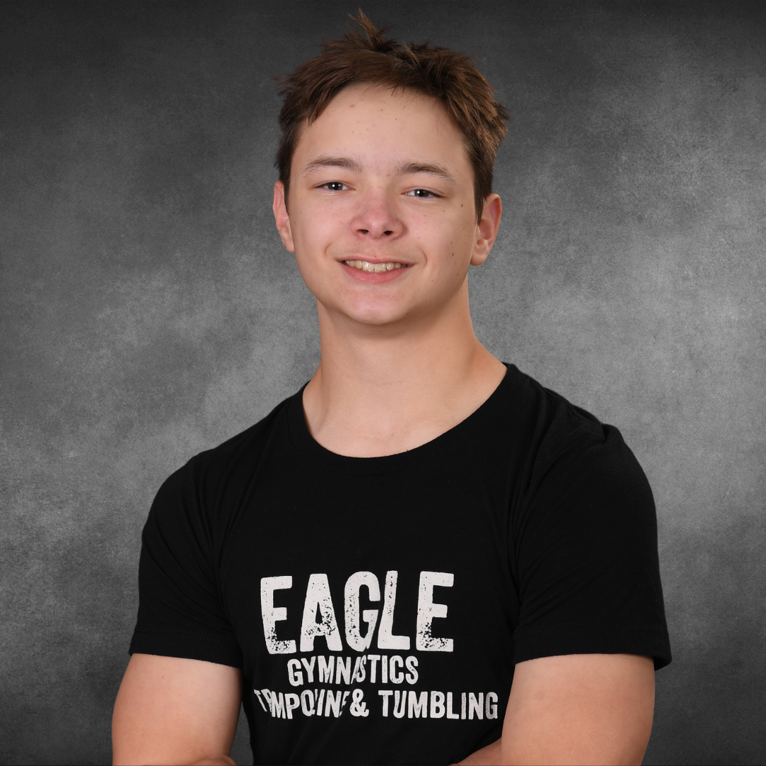 A young man wearing an eagle gymnastics t-shirt