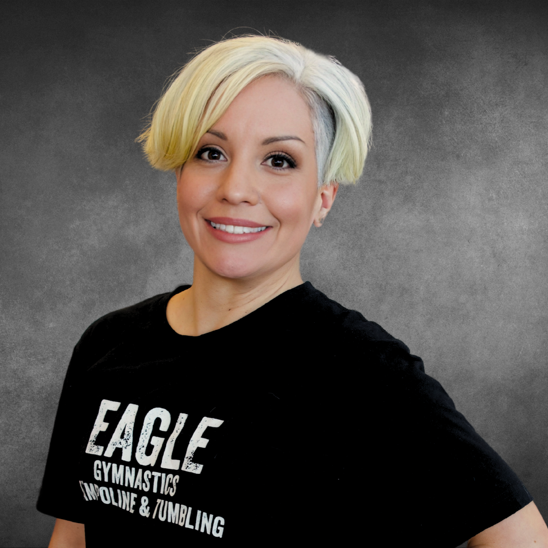 A woman wearing a black shirt that says eagle on it