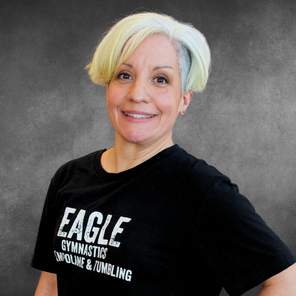 A woman wearing a black shirt that says eagle on it